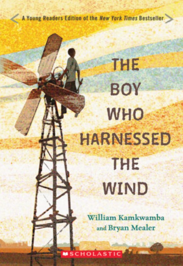 Children's book cover of boy standing on a windmill
