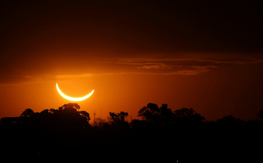 The moon passes in front of the setting sun during a total solar eclipse in Buenos Aires, Argentina, on Tuesday, July 2, 2019. Small towns and rural enclaves along the path of April’s 2024 total solar eclipse are steeling for huge crowds of sun chasers who plan to catch a glimpse of day turning into dusk in North America.


Marcos Brindicci/AP File Photo