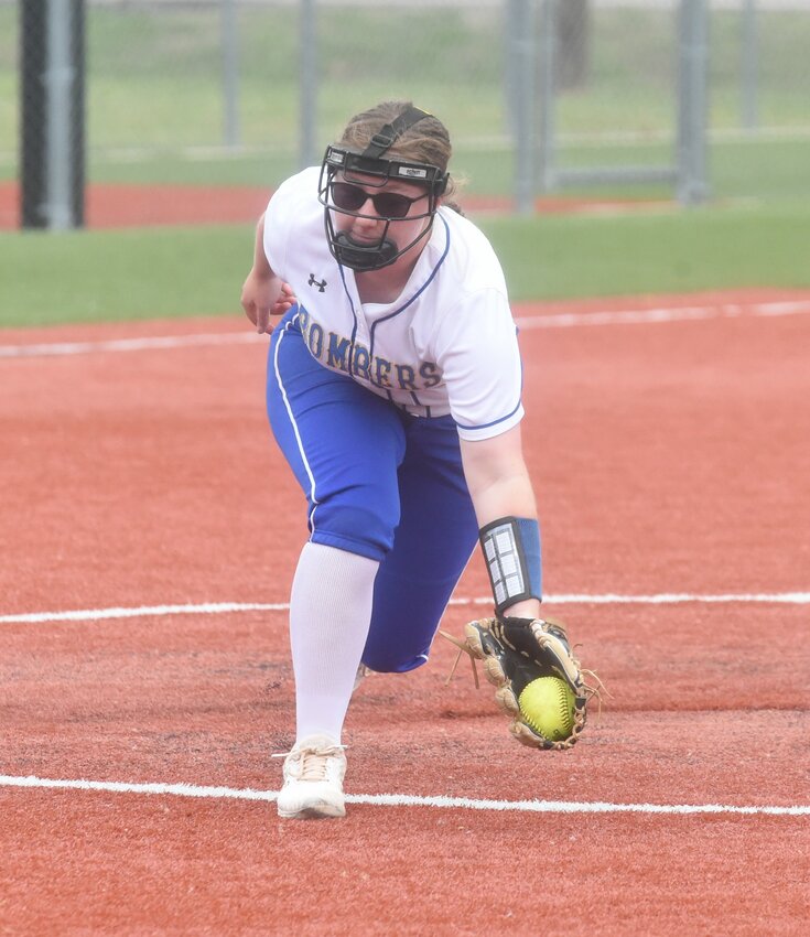 Mountain Home pitcher Emma King fields a ground ball during the Lady Bombers' loss to Greenwood on Tuesday.