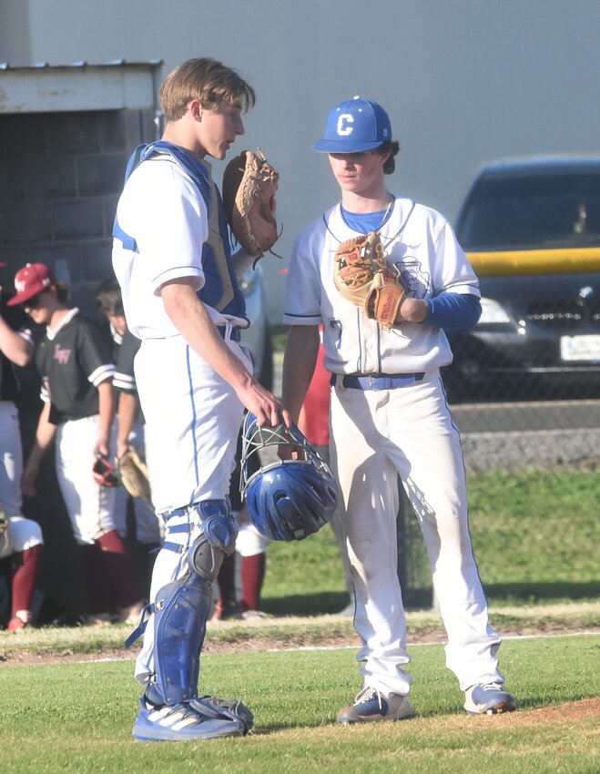Cotter's Kolby Vinson (right) and Cole Tilton talk things over during a recent home game.