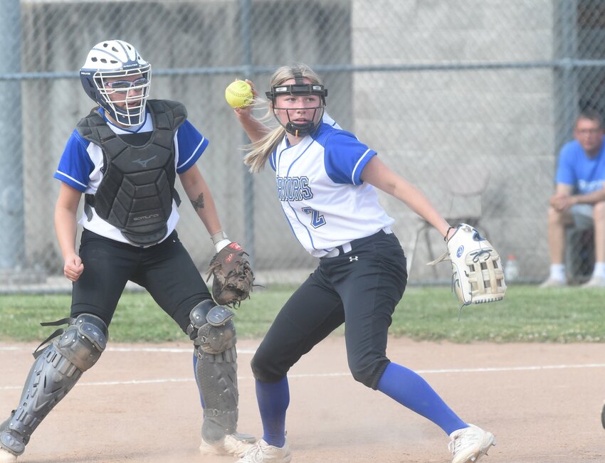 Cotter pitcher Gracyn Jackson fields a bunt and throws to first base as catcher Emma Jones watches the play Thursday against Calico Rock.