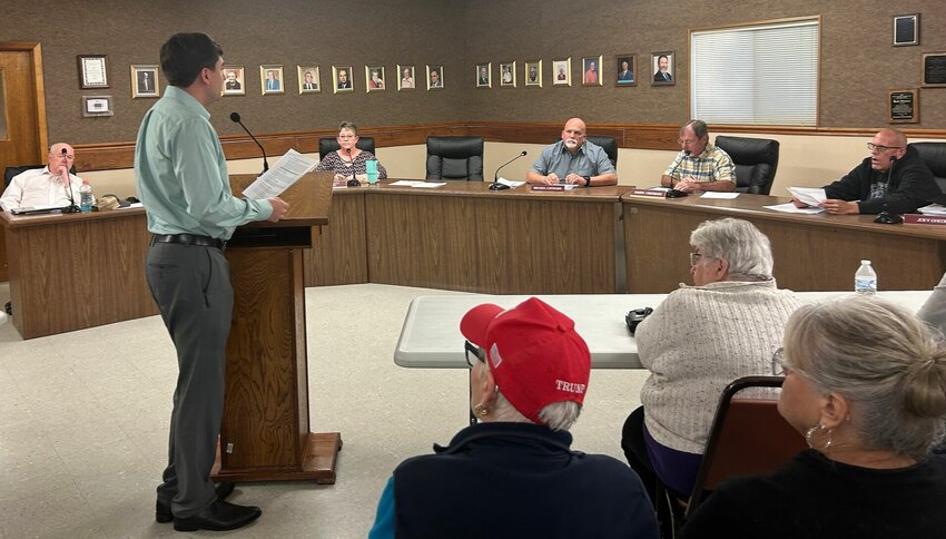 Bull Shoals City Attorney William King (standing) addresses members of the Bull Shoals City Council and the public during Monday's special meeting. King was consulted on both the current mayoral vacancy and a controversy of a local developer's planned rehabilitation of an apartment complex.


Caroline Spears/The Baxter Bulletin