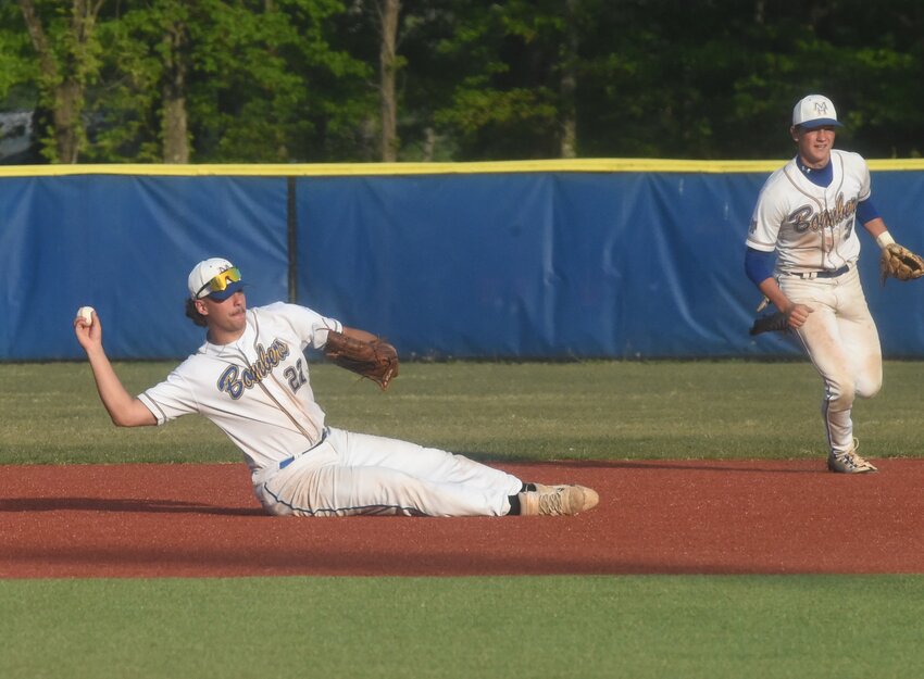 Mountain Home first baseman Corwin Morris makes a diving stop and throws to the pitcher during action against Greenbrier on Tuesday night.