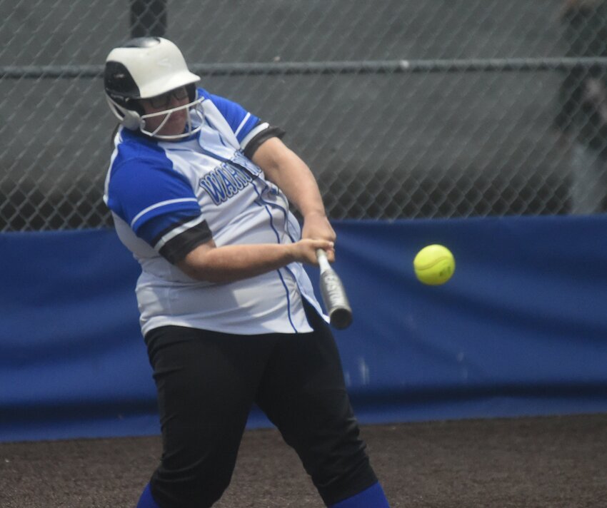 Cotter's Emily O'Neal connects with one of her two RBI hits on Thursday against Yellville-Summit in the 2A-1 District tournament.