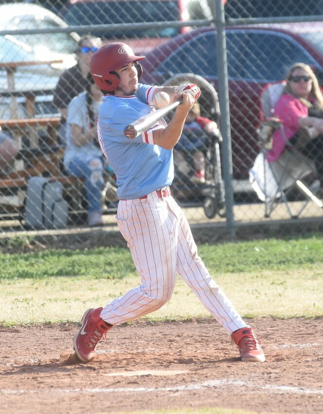 Norfork's Erik Foster pops up a pitch during action earlier this season. Norfork baseball and Viola softball both advanced at Thursday's 1A Region 2 tournaments.