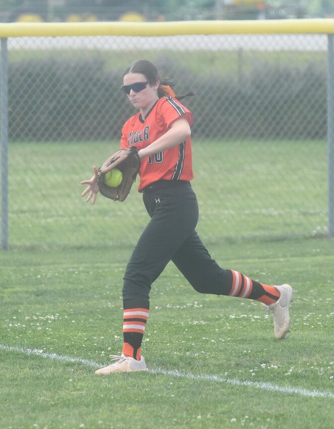 Viola's Kailey Hallmark fields a ball on the left-field line against West Side on Saturday.
