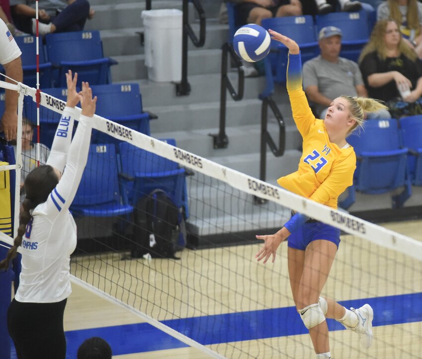 Mountain Home's Annyston Crooker hits against West Memphis during the Lady Bombers' three-set victory Thursday night.