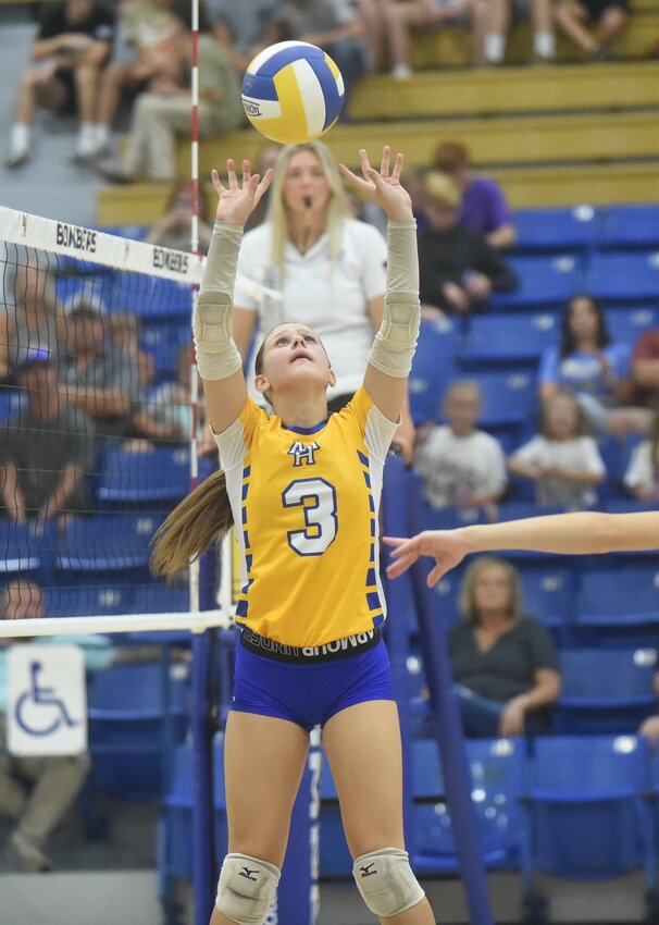 Mountain Home's Violet Daugherty sets during a recent home match. The Junior Lady Bombers won their fifth and sixth matches of the season on Thursday.