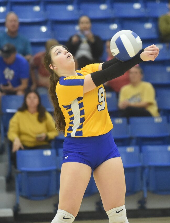 Mountain Home's Macy Farris passes during the Junior Lady Bombers' match against Brookland on Monday.