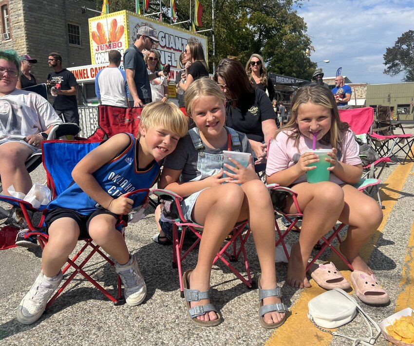 Tidus Cooper (from left), Ayla Cooper and Adah Cunningham wait for the ever-popular lip sync contest to begin at the 78th annual Turkey Trot Festival Saturday, Oct. 12 in Yellville.


Submitted Photo