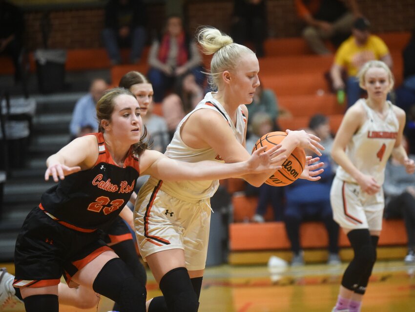 Viola's Taylor Richardson corrals a loose ball ahead of Calico Rock's Emma Brickell (23) during their 1A-2 Conference game Monday at Longhorn Corral.