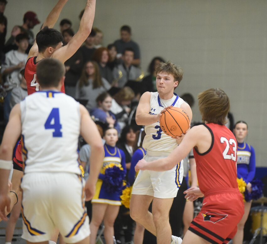 Mountain Home's Drew McGehee (3) looks to pass against Farmington on Tuesday night.