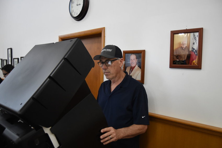 Andy Parish votes Monday afternoon at the Baxter County Courthouse. Early voting across the Twin Lakes Area surged Monday in anticipation of Tuesday's primary election.   Scott Liles/The Baxter Bulletin