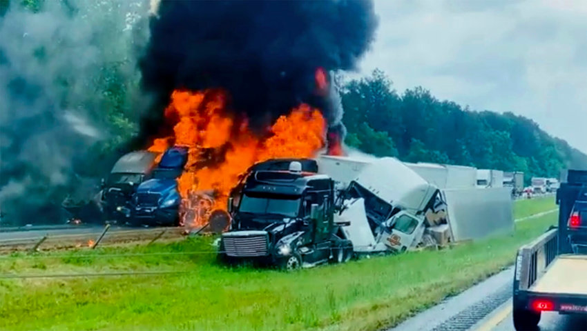 In this image taken from video, flames and smoke billow from trucks involved in a deadly multiple-vehicle crash along Interstate 30 Wednesday in southwestern Arkansas.   Joni Deardorff/AP Photo