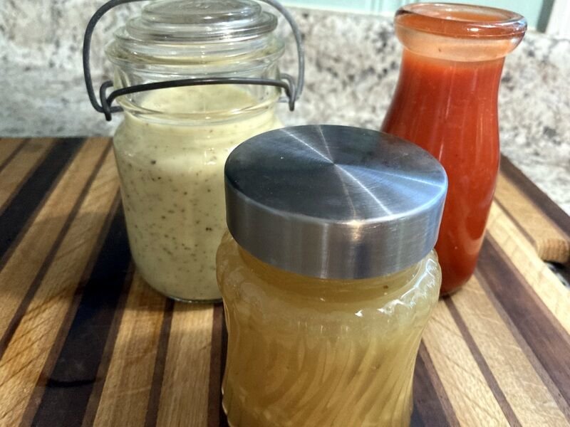 Homemade salad dressings take only minutes to make and taste so fresh on summer vegetable and fruit salads. Shown are (front) Oriental Ginger Dressing and (back left) Poppyseed Dressing and Catalina Dressing.   LINDA MASTERS/THE BAXTER BULLETIN