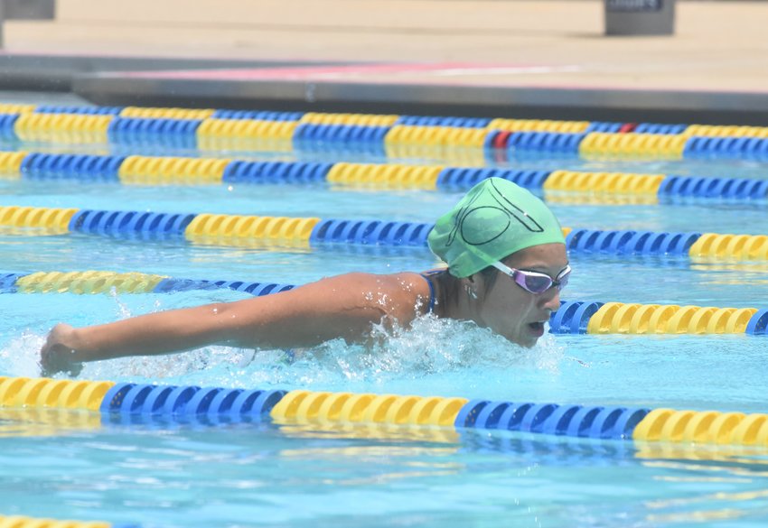 Mountain Home's Joia Traver, pictured in the 100-meter butterfly, was the high-point winner in the 18-and-under girls' division at Saturday's South Wind Conference championship meet at Cooper Park.