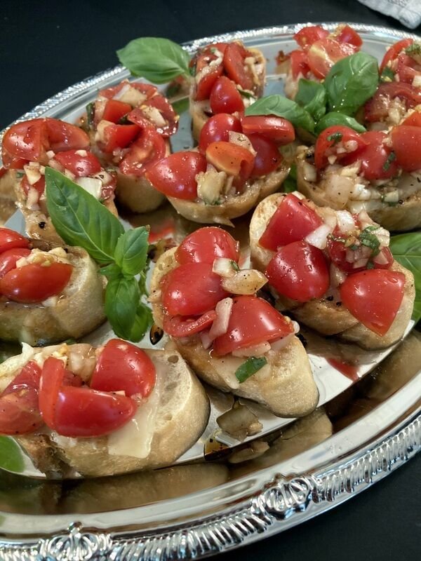 Ripe tomatoes, fresh basil and onion are dressed in tangy balsamic vinegar and oil and served atop crisp, garlic-flavored crostini.   Bulletin Photo/Linda Masters