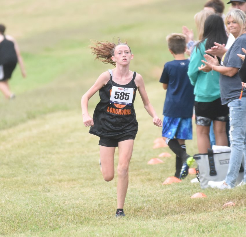 Viola's Missy Wilson nears the finish line to win the junior girls' race at the Bomber Invitational on Thursday at ASUMH.