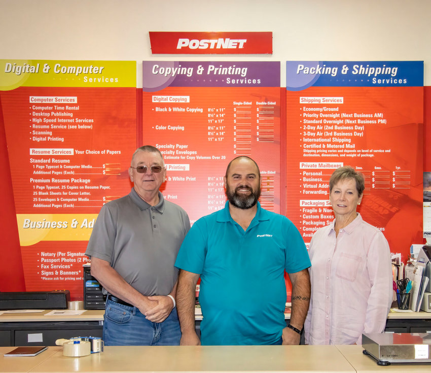 Mike and Toni Fisher are the new owners of PostNet. Shown are: (from left) Mike Fisher, employee Michael Bailey and Toni Fisher.   Submitted Photo