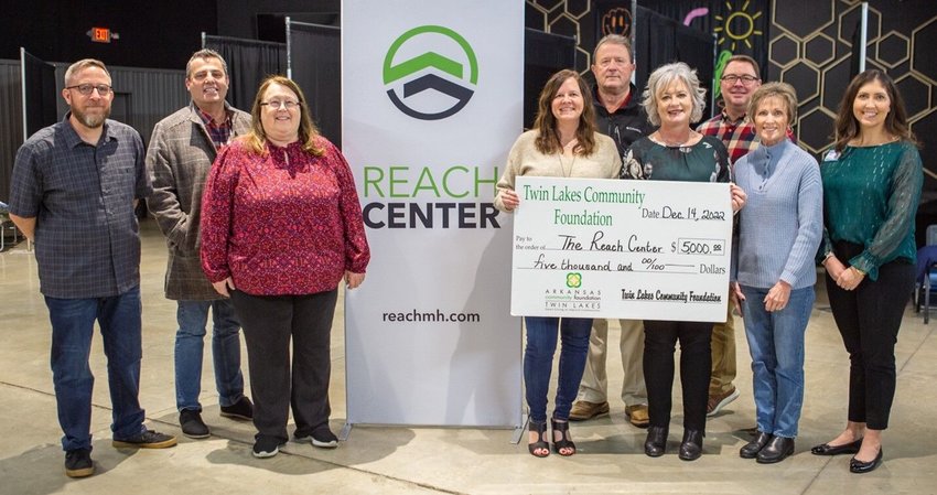 Shown giving the Twin Lakes Community Foundation $5,000 donation to The Reach Center are (first row, from left) Sara Zimmerman, Homeless Initiative Task Force member; Jennifer Daniel, The Reach Center and&nbsp;Kimberly Jones, TLCF executive director and Deborah Knox,&nbsp;Initiative Task Force member; (second row)&nbsp;Kirby Brown, The Reach Center; Jeff Quick,&nbsp;Initiative Task Force member;&nbsp;Mayor Hillrey Adams and the Rev. Daniel Thueson and Sarah Edwards,&nbsp;Initiative Task Force members.   Submitted Photo