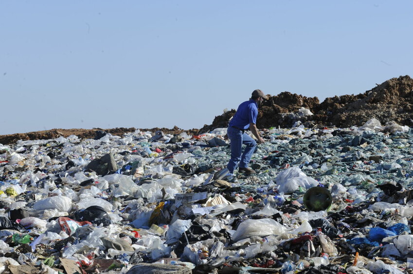 In this 2012 file photo, a worker traverses trash at the now-closed NABORS landfill near Three Brothers. The Friends of the North Fork and White Rivers is challenging assertions made by a LRS representative last week in a guest column. LRS is seeking to purchase the landfill, maintain the previous pollution controls and open new cells at the site.   Bulletin File Photo