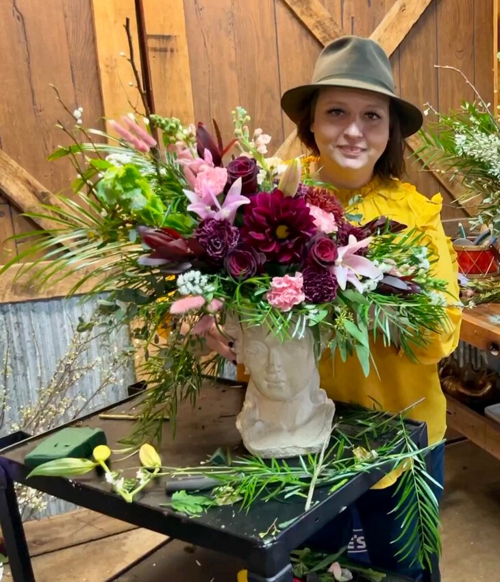 While Gassville resident and Cotter High School graduate Amanda Alman admits she wasn&rsquo;t a fan of flowers before she became an Arkansas Master Florist and Nationally Certified Floral Designer, she has stayed busy with her flower business Rockin Roses in Gassville.   Helen Mansfield/The Baxter Bulletin
