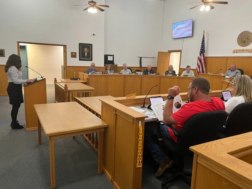 Baxter County Library Director Kim Crow-Sheaner (left) addresses Justices of the Peace during Tuesday's Baxter County Quorum Court meeting. Justices received updates on several county endeavors during the evening.   Vincent Anderson/Special to The Bulletin