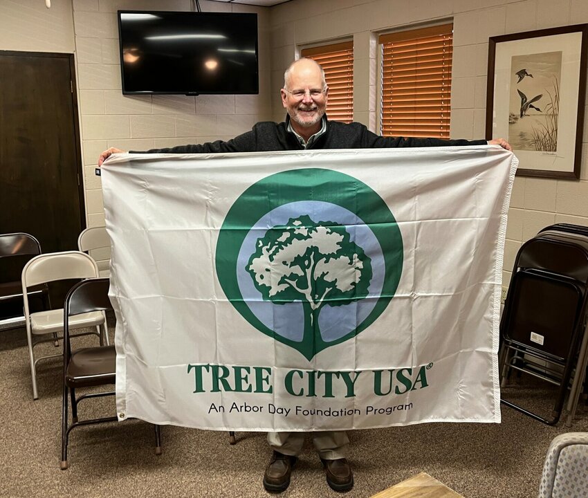 Cotter Mayor Mac Caradine recently received a new Tree City USA flag from the Arbor Day Foundation. The city of Cotter received the distinction as a tree city in 2022 for the 12th year in a row. Caradine said the U.S. Forest Service has donated an autumn blaze maple tree, which will be planted during the city&rsquo;s upcoming First Security Trout Festival on Saturday, May 6.   Helen Mansfield/The Baxter Bulletin