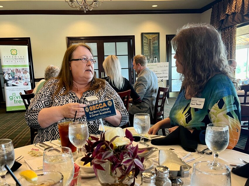 Twin Lakes Community Foundation (TLCF) Board Members Sara Zimmerman visits with Flippin Art Teacher Cheryl Blasdel Friday during TLCF&rsquo;s annual grant awards luncheon at Big Creek Golf &amp;amp; Country Club.   Helen Mansfield/The Baxter Bulletin