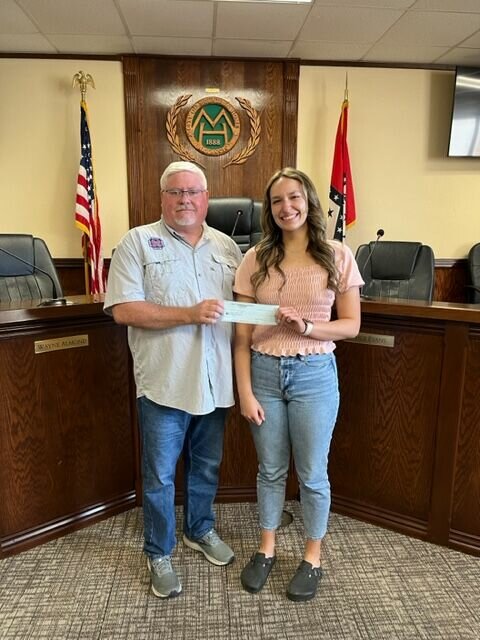 27th Arkansas Infantry Camp Commander Kevin Bodenhamer presented Sadie Quick with a $500 scholarship check for her state-winning essay entitled: &ldquo;History of Schools and Education in Arkansas.&rdquo;   Photo Submitted