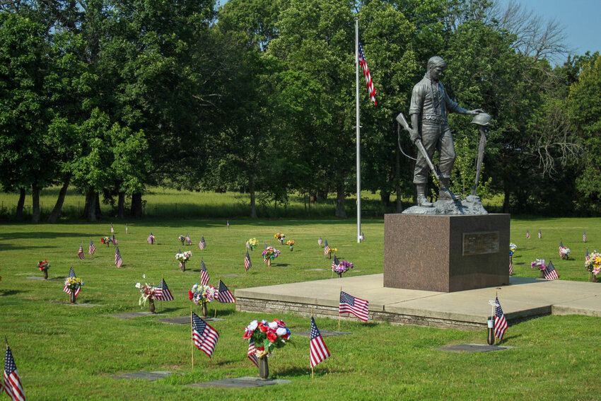 An array of American flags flutter in the wind by each veteran&rsquo;s headstone at Kirby&rsquo;s Tucker Memorial Cemetery on Thursday morning, after being placed by members of Alley-White American Legion Post 52 and community members in honor of the Memorial Day holiday.   Ethan Granniss/Special to The Bulletin