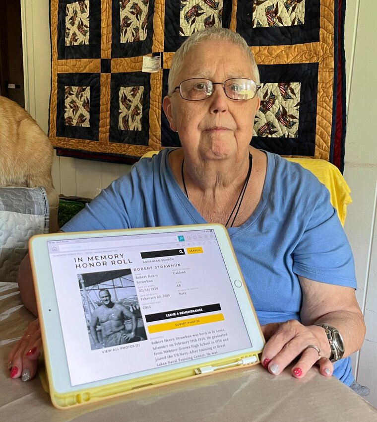 Marilyn Strawhun of Oakland displays the webpage honoring her late husband of 51 years, Robert &ldquo;Bob&rdquo; Henry Strawhun. The page is part of the Vietnam Veterans Memorial Fund (VVMF) In Memory program, designed to honor the group of the thousands of Vietnam Veterans who &ldquo;suffered due to Agent Orange exposure, PTSD and other illness as a result of their service.&rdquo;   Helen Mansfield/The Baxter Bulletin