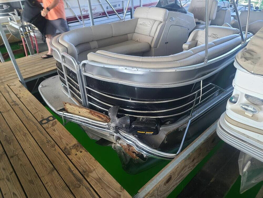 A damaged pontoon boat is shown Tuesday at Cranfield Marina. A 74-year-old Baxter County man died after a water incident, which remains under investigation by authorities.   Photo courtesy of the Baxter County Sheriff's Office