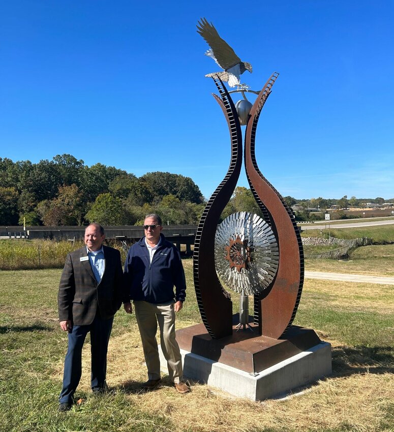 Arkansas State University-Mountain Home Chancellor Dr. Bentley Wallace (left) and Mountain Home Mayor Hillrey Adams are shown next to the first piece of artwork on the Art Walk Trail. The trail and artwork were officially dedicated Tuesday.   Caroline Spears/The Baxter Bulletin