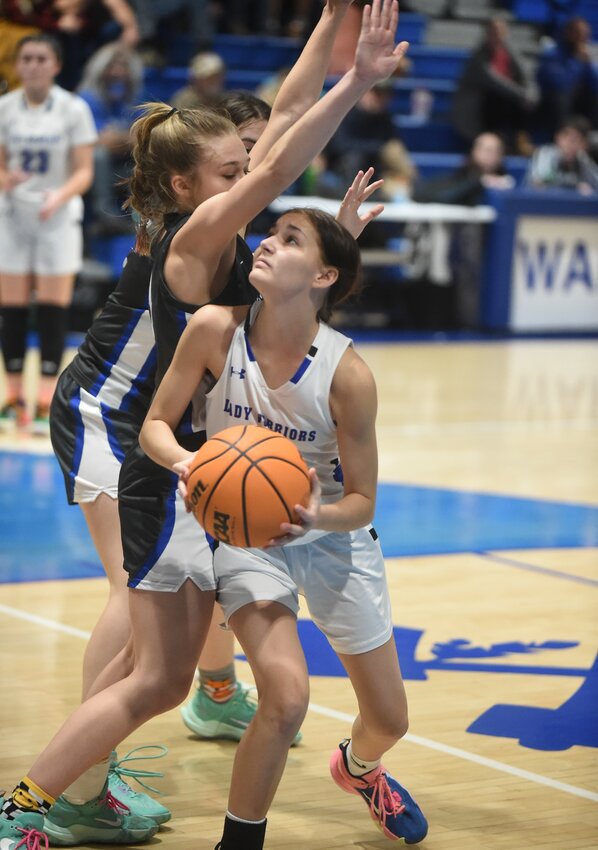 Cotter's Addison Decker looks to attempt a shot during the Lady Warriors' 59-51 conference victory over Ozark Mountain on Tuesday.