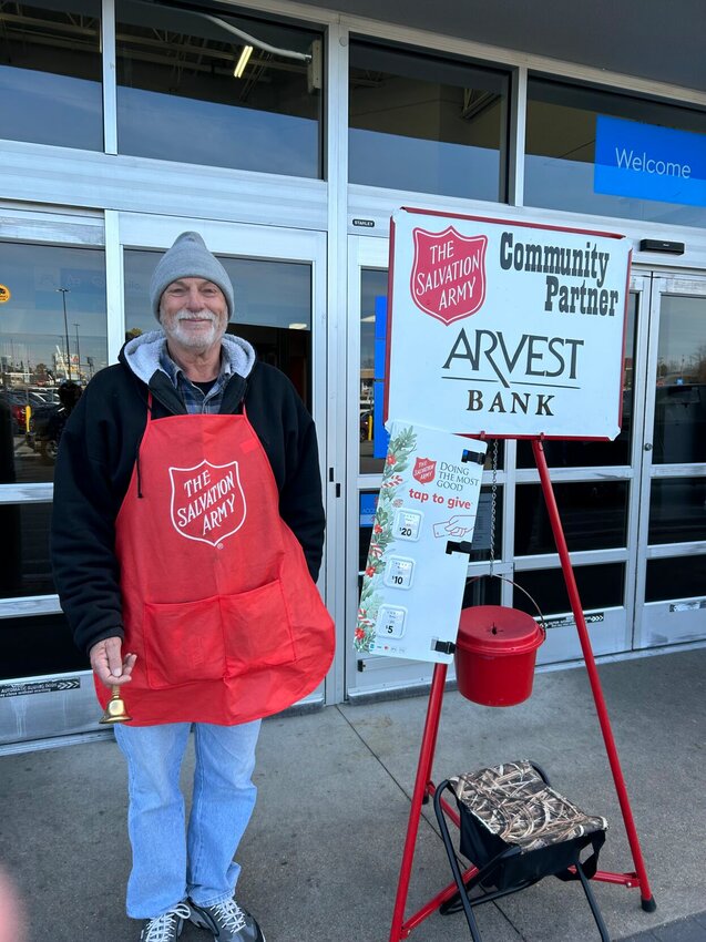 Daniel Treatham rings a bell at the Salvation Army Red Kettle located at the Mountain Home Walmart. The Salvation Army has issued a plea for volunteers to ring bells, as well donors to help reach the organization's fundraising goals.   Caroline Spears/The Baxter Bulletin