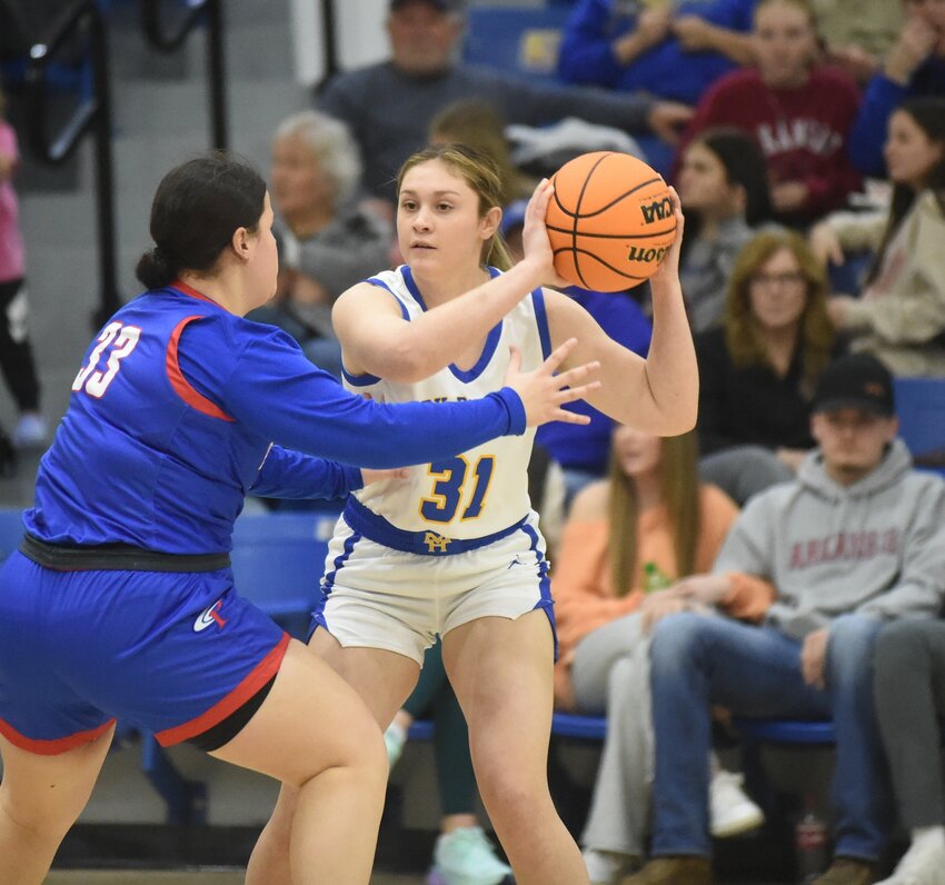 Mountain Home's Ashlyn Estes looks to pass during the Lady Bombers' 49-20 victory over Paragould on Wednesday night.