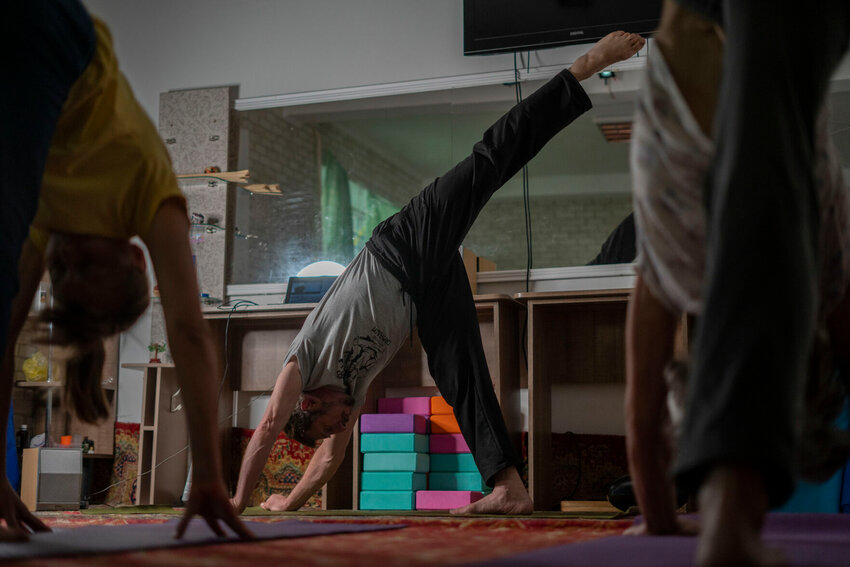 A yoga class is shown in this file photo. The practice of Yoga is known to relieve stress, gain or maintain strength and improve wellness, a common New Year's resolution.   Hanna Arhirova/AP File Photo