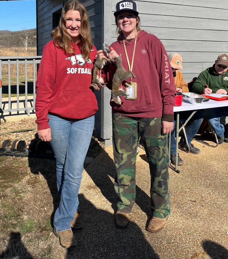 Two teens celebrate at Fred Berry Nature Center in Yellville after a morning of squirrel hunting as part of the Big Squirrel Challenge.   Submitted Photo