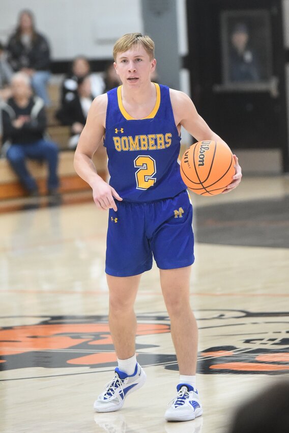 Mountain Home's Blaine Tate, pictured earlier this season at Batesville, scored 22 points and swiped a state-record-tying 12 steals in the Bombers' win at Siloam Springs on Friday night.