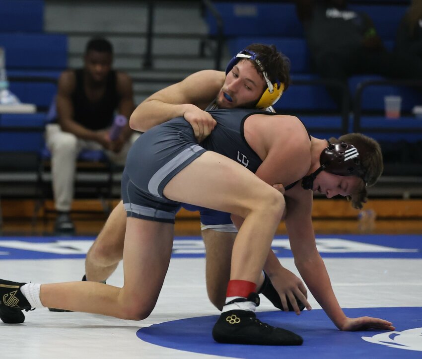 Mountain Home's Isaiah Merry won all four of his matches at the Class 5A State Duals on Saturday at Sylvan Hills, leading the Bombers to a fourth-place team finish.