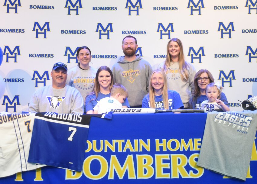 Mountain Home's Brooklyn Arms signed Wednesday to play college softball at Williams Baptist University. Pictured are family (front row), Bryan Arms, Breelyn Wehmeyer, Hadden Wehmeyer, Brooklyn Arms, Christi Arms, Adelaide Wehmeyer; (back row) coaches Tess Temple, Blake Hendricks and Shelby Henry.