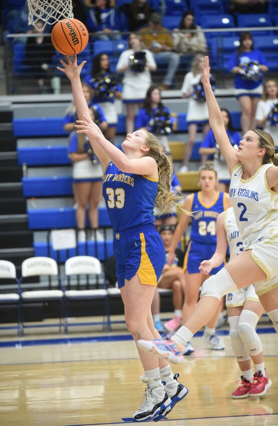 Mountain Home's Livi Fosness scores against Harrison last week. The Lady Bombers remained ranked No. 4 in Class 5A in the most recent Arkansas Sports Media basketball polls voted on by state-wide media.