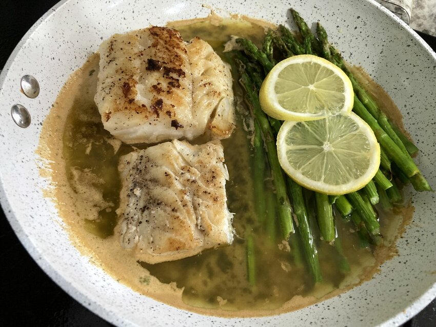 Garlic Butter Cod with Lemon Asparagus is a quick-and-easy Lenten dish for meatless Fridays.   Linda Masters/Baxter Bulletin