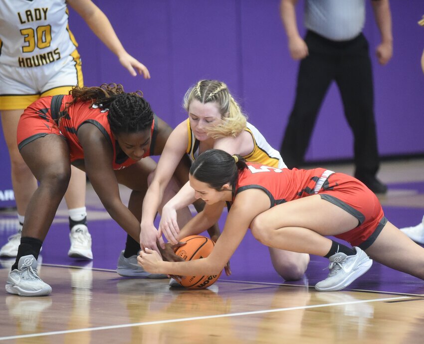 Salem's Maddie Keen battles two Drew Central players for a loose ball on Wednesday in the Class 3A State tournament at Elkins.