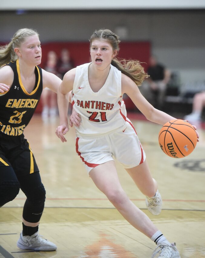 Norfork's Maggie Tyrone drives to the basket Friday for two of her 22 points against Emerson in the Class 1A State quarterfinals at Harrison.