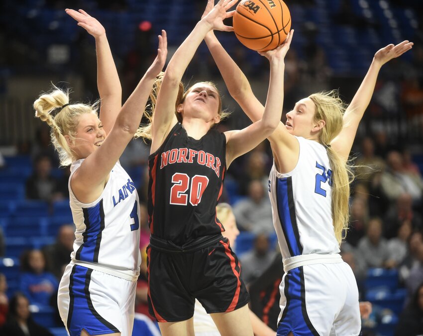 Norfork's Liza Shaddy is defended by Mammoth Spring's Laney Young (left) and Adrianna Corbett (right) during the Class 1A State championship on Saturday in Hot Springs.