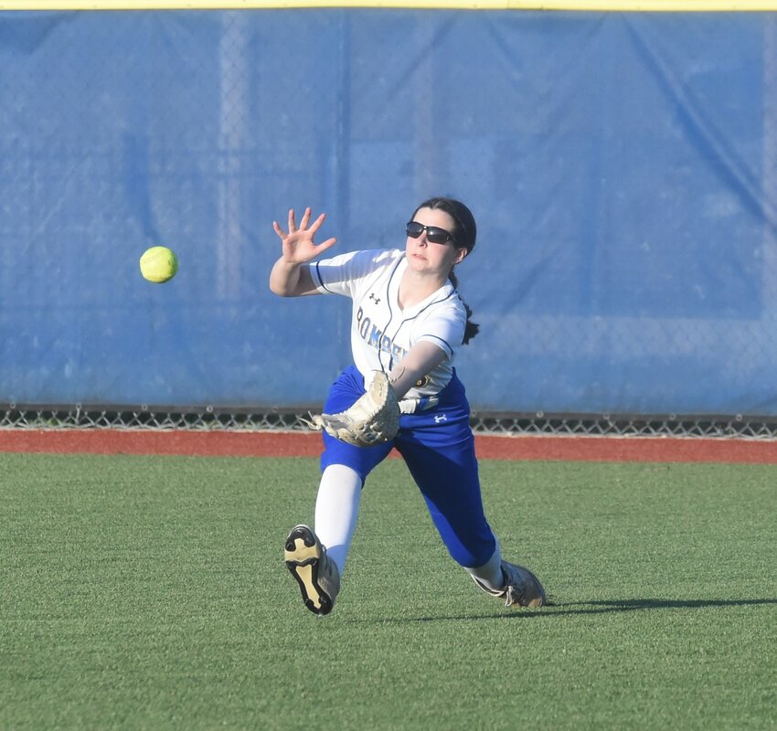 Mountain Home centerfielder Karleigh Drewry dives to make a catch against Siloam Springs on Tuesday.