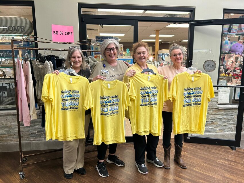 Friends of the &quot;Pink-A-Dilly&quot; gift shop in Baxter Health's Main Campus wore smiles as bright as the cheerful shirts they have on hand for purchase to commemorate this month's Great American Eclipse. Baxter Health joins local law enforcement and surrounding agencies to provide the community with the unwavering care they offer, as the catchy shirt's phrase states ... &quot;Even When the Sun Don't Shine.&quot;   Caroline Spears/The Baxter Bulletin