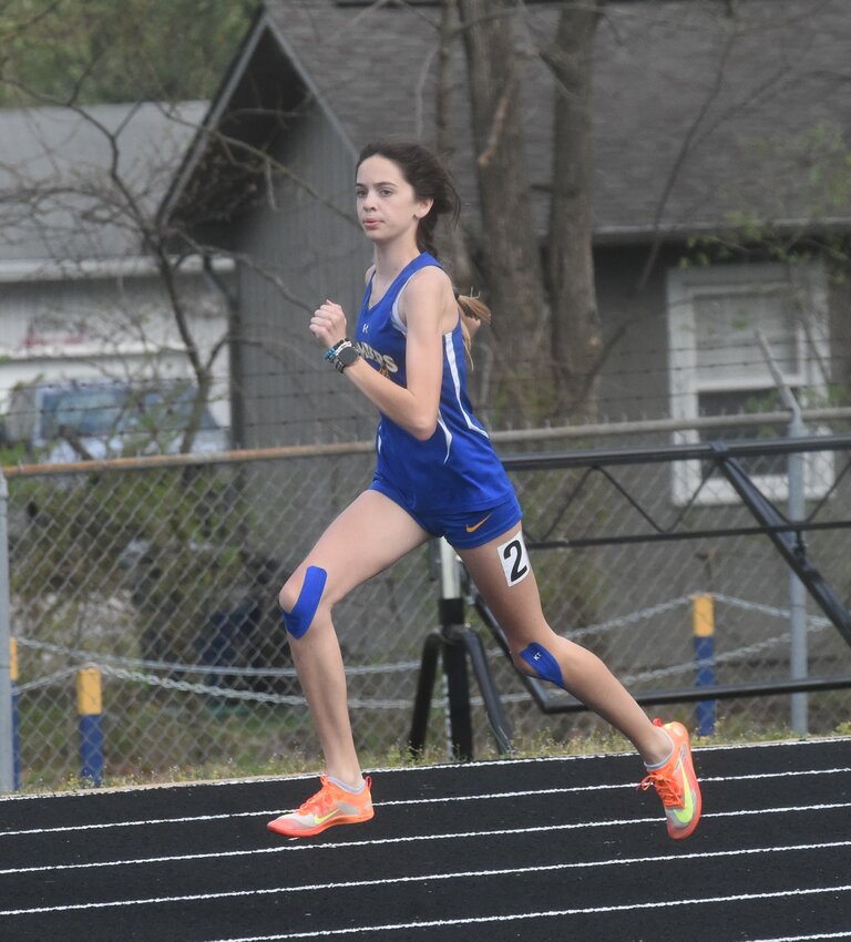 Mountain Home's Cisily Goettler, pictured in action at the recent meet at Bomber Stadium, won both the 800 and 1600 on Tuesday at Harrison.
